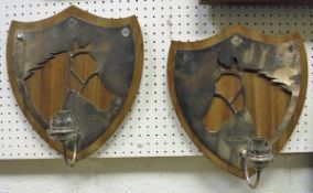 A pair of modern walnut and silver plated shield shaped candle sconces,