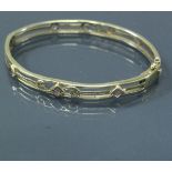 A Victorian style 9 carat gold stone set bangle,