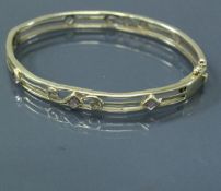 A Victorian style 9 carat gold stone set bangle,