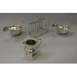 A pair of Victorian silver sauce boats of helmet form (by John Milward Banks, London 1889) 7.