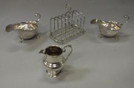 A pair of Victorian silver sauce boats of helmet form (by John Milward Banks, London 1889) 7.