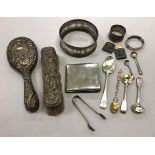 A collection of silver wares, etc, to include a bottle coaster, ring, silver cigarette case,