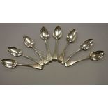 Twelve various Georgian silver "Fiddle" pattern dessert spoons,
