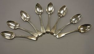 Twelve various Georgian silver "Fiddle" pattern dessert spoons,