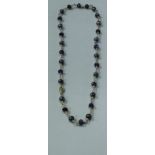 A 9 carat gold hermatite and amethyst bead necklace