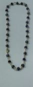 A 9 carat gold hermatite and amethyst bead necklace