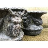 A pair of 18th Century (possibly earlier) lead garden urns with satyric mask and floral drape