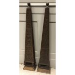 A pair of 19th Century carved oak obelisks or wall brackets with blind fretwork decoration