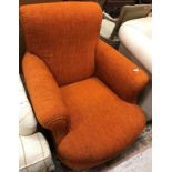 A 19th Century orange upholstered arm chair in the manner of Howard together with a copper coal