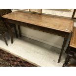 A 19th Century oak serving table the plain top with moulded edge above a medallion decorated frieze