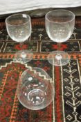 A set of five Baccarat Crystal red wines together with a set of four Tiffany & Co stemless brandy