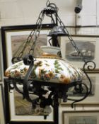 A modern black painted wrought iron and glazed pottery ceiling light