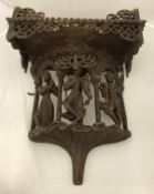 A Burmese teak domestic Buddha bracket/stand with figural and carved decoration,