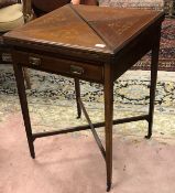 An Edwardian mahogany and inlaid envelope card table