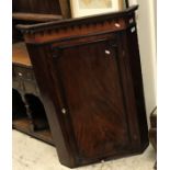 A George III mahogany hanging corner cupboard together with an 18th Century walnut and inlaid slat