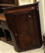 A George III mahogany hanging corner cupboard together with an 18th Century walnut and inlaid slat