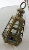 A 19th Century Dutch colonial embossed brass hanging lantern of hexagonal tapering form