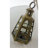 A 19th Century Dutch colonial embossed brass hanging lantern of hexagonal tapering form