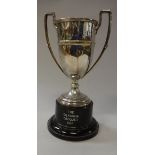 An Edward VIII silver trophy cup of faceted form raised on a circular foot (Chester 1936) 8.