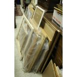 A large collection of picture and mirror frames of varying sizes