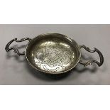 A George II silver twin-handled lemon strainer (possibly by Benjamin Cartwright I, London 1748),
