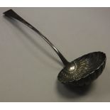 A George III silver "Old English" pattern soup ladle with shell shaped bowl (by William Sumner,