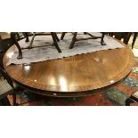 A modern mahogany circular dining table raised on central pedestal support CONDITION