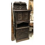 A Victorian Gothic Revival oak cupboard