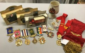 A collection of ROAB medallion, badges,