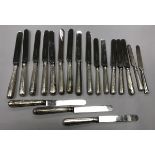 A collection of various silver sheathed handled steel dinner and dessert knives (various dates and