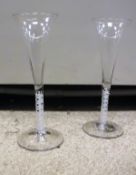 A pair of 18th Century enamel twist ale flutes