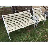 A modern painted cast metal bench with lion mask arms together with a matching chair