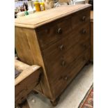 A Victorian pine chest of two short over three long graduated drawers