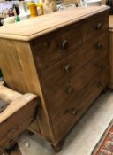 A Victorian pine chest of two short over three long graduated drawers