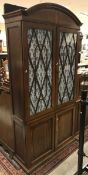A Victorian mahogany and inlaid bookcase cabinet