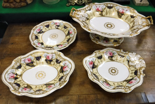 A 19th Century Staffordshire rose and cornucopia decorated dessert service comprising tazza,