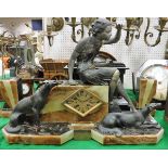 An Art Deco onyx and patinated spelter clock group garniture with woman seated upon a block and two