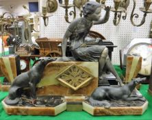 An Art Deco onyx and patinated spelter clock group garniture with woman seated upon a block and two