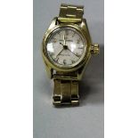 A late 20th Century 18 carat ladies gold Rolex Oyster Precision wristwatch and strap.