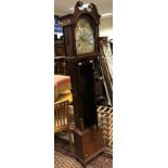 A mahogany and inlaid cased long case clock.