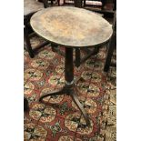 A 19th Century decoupage decorated pine occasional table on tripod base