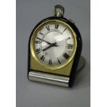 A mid 20th Century Jaeger Lecoultre folding travel clock with black lacquered mounts,