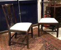 A pair of 19th Century Chippendale style dining chairs with pierced splat backs