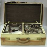 An early 20th Century velum suitcase by Finnigan's of Bond Street London,