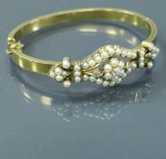 An un-tested 18 carat gold Victorian bangle set with diamonds and pearls, 15 g,