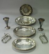 A box of assorted plated wares to include entree dish, toast rack, wine funnel, goblets, cutlery,