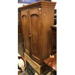 A 19th Century ash two door wardrobe with single drawer to base