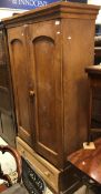 A 19th Century ash two door wardrobe with single drawer to base