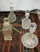 A collection of cut glass decanters to include two pairs,