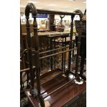 A circa 1900 mahogany drop leaf Sutherland table together with a Victorian style towel rail,